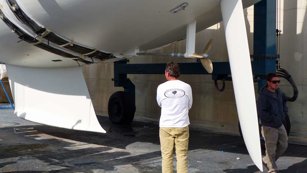 Damon Hulst inspects the hull before launch in Santa Barbara's boatyard Harbor Marineworks