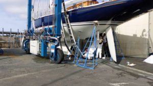 Placing aft straps on sailboat at Harbor Marineworks Santa Barbara